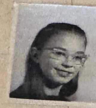 School photo taped to letter L16