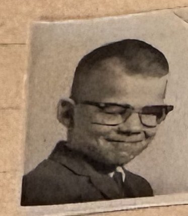 School photo taped to letter L32