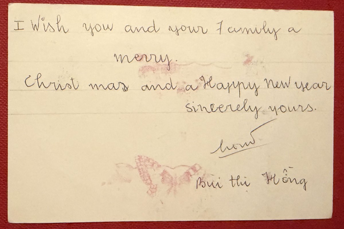 Handwritten back of a card: I wish you and your family a merry Christmas and a Happy New Year, sincerely yours, signed Bui thi Hồng