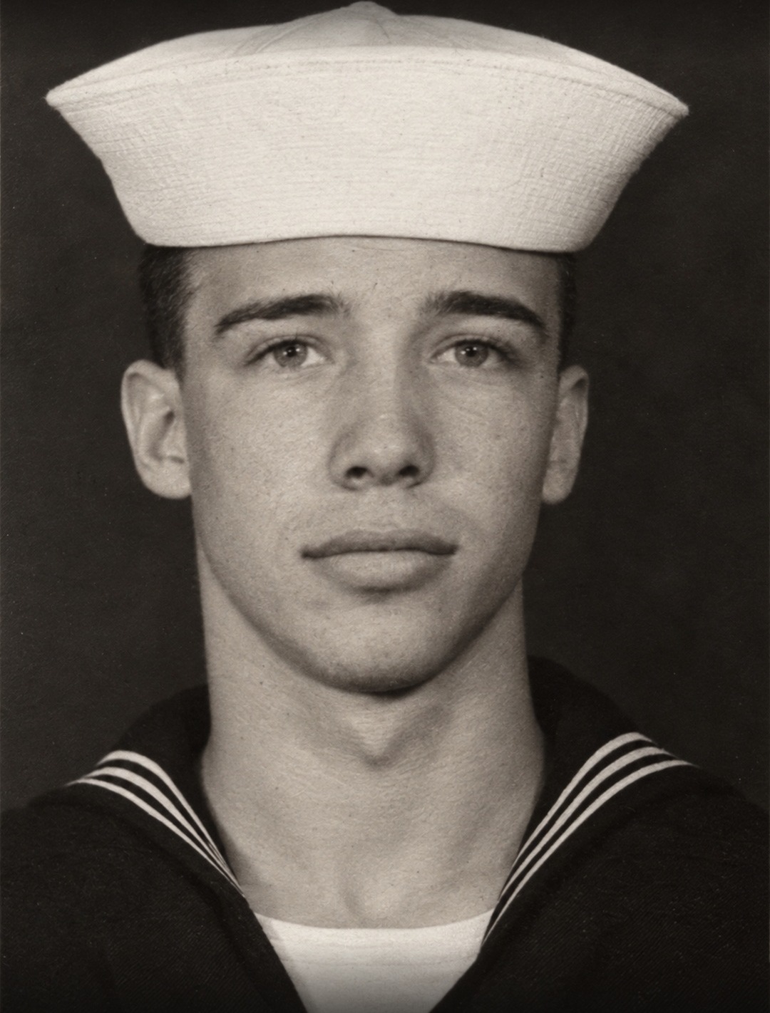 HM3 Russell Jacobson, U.S. Navy, in his white cap